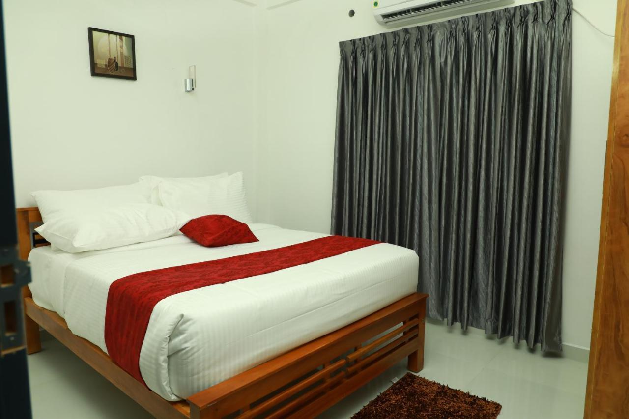 Achoos Residency Hotel Tiruvalla Exterior photo